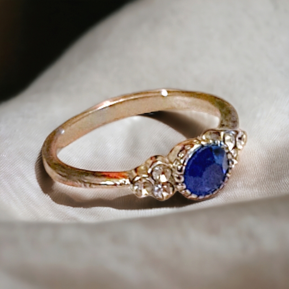 Beautiful ring with blue center stone and 3 CZ on each side. Size 5 - Picture 2 of 3